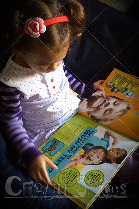 Mighty Leaf Giveaway Event Kira enjoying a National Geographic book