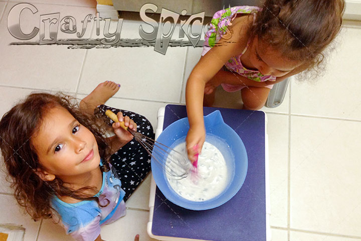 Kira and Kaylee learning about mixing things together