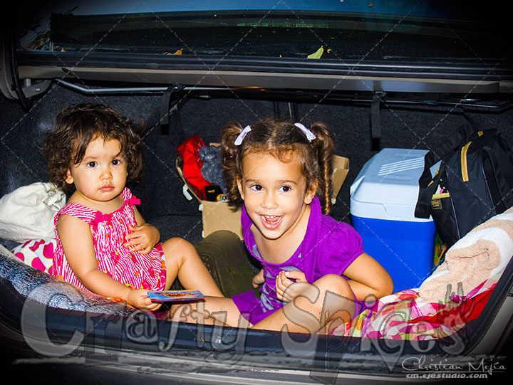 Kira and Kaylee having fun in the trunk of our car