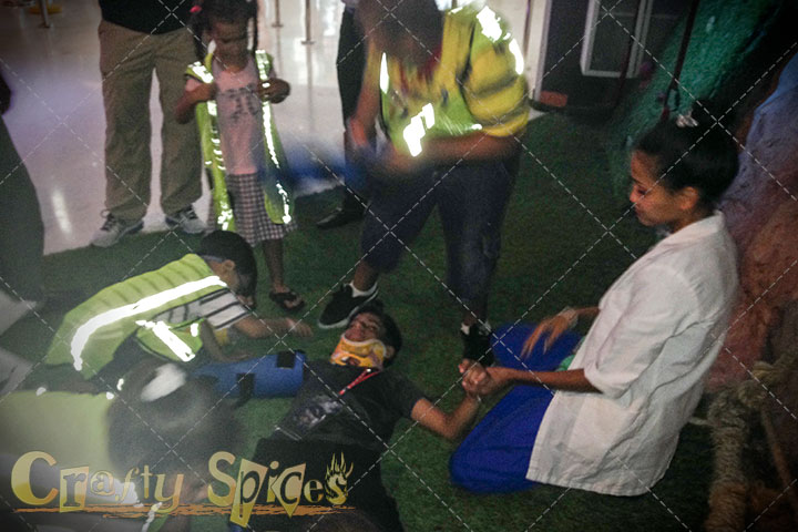 Children helping an injured person (make believe)