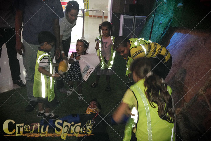 Children helping an injured person (make believe)