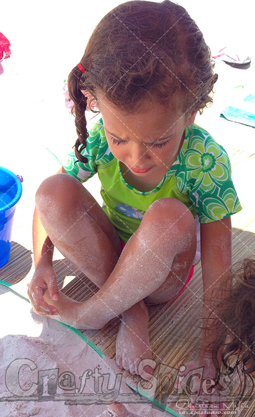 Kira playing with the sand